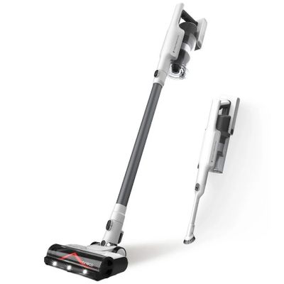 a close up of a vacuum and a stick on a white surface