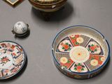 a table with a bowl, plate, and other items on it