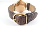 an image of a wrist watch with a brown leather band