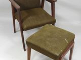 a brown chair and a brown ottoman on a white background