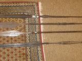 four knives on a rug on the floor