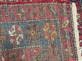 an image of a close up of a rug with a cat laying on top of it