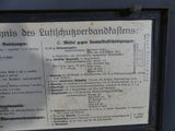 a sign on the side of a building that has a list of items on it