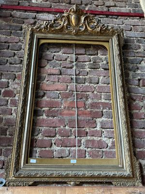 a picture of a picture frame hanging on a brick wall
