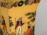 a yellow vase with a painting of people on it