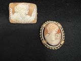 two cameo cameos of a woman and a man in profile