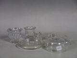 three glass vases sitting on a table with labels on them