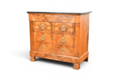 a small chest of drawers with a marble top