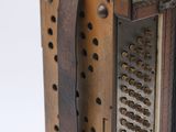 a close up of a musical instrument on a white surface