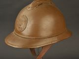 a helmet that is on a stand on a black background