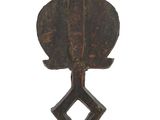 an image of a wooden sculpture of a bird on a stand