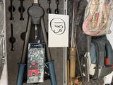a tool case filled with tools and other items
