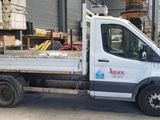 a white truck that is parked in a warehouse
