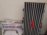 a black and white striped door next to a box of tools