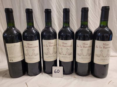 six bottles of wine are lined up in a row on a table