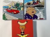 three children ' s books on a wall in a room
