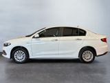 the white car is parked on the concrete floor in the room