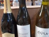 several bottles of wine are lined up on a table