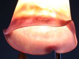a close up of a lamp that is on a stand