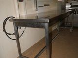 an image of a kitchen area with a table and a stove