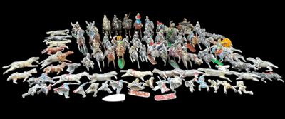 a large group of toy animals that are on a black background