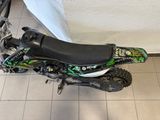 a motorcycle that is sitting on the floor in the room
