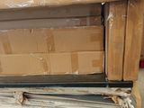 a stack of boxes on a pallet in a warehouse