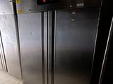 an image of a commercial kitchen with stainless steel refrigerators
