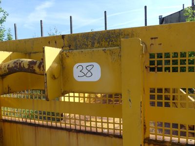 a close up of a yellow gate with a number 33 on it