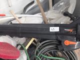 an image of a blow gun sitting on top of a pile of tools