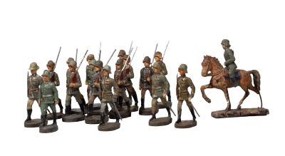 figurines of a group of soldiers on horses and horses