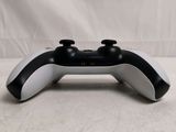 a close up of a video game controller on a table