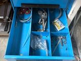 a blue box with tools in it on a table