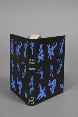 an open box with blue silhouettes on it sitting on a gray surface