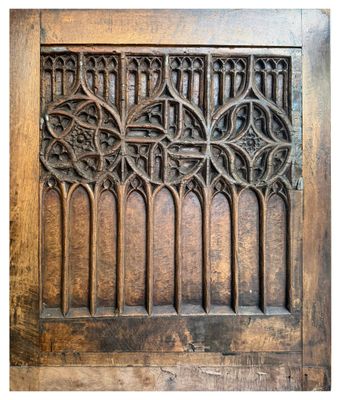 an old wooden door with a decorative design on it
