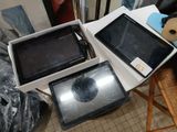 several electronic devices are sitting on a table in a room