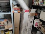 a room with a lot of boxes and boxes on the shelves