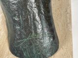 a statue of a man riding a horse on a block