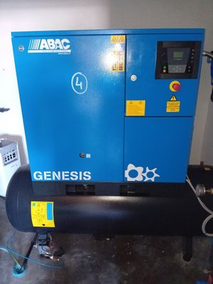 a close up of an air compressor in a garage