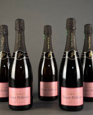 a group of six bottles of champagne sitting on top of a table