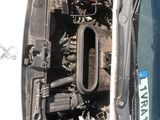 a car that has its hood open with the engine in it