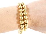 a close up of a person ' s arm wearing a bracelet