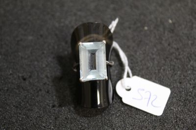 a small black object with a white tag on it