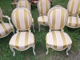 many chairs that are sitting in the grass