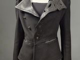 a black jacket and skirt suit with a leather collar on a mannequin mannequin mannequin mannequin mannequin mannequin manne