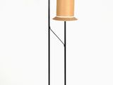 two lamps on a tripod stand with a lamp shade on top