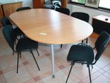 a table and chairs in a room with tile flooring