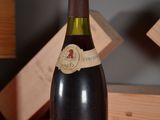 a bottle of wine that is sitting on a table