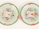 pair of chinese famille plates decorated with flowers and birds