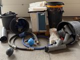 a lot of garbage that is on the ground next to a garage door
